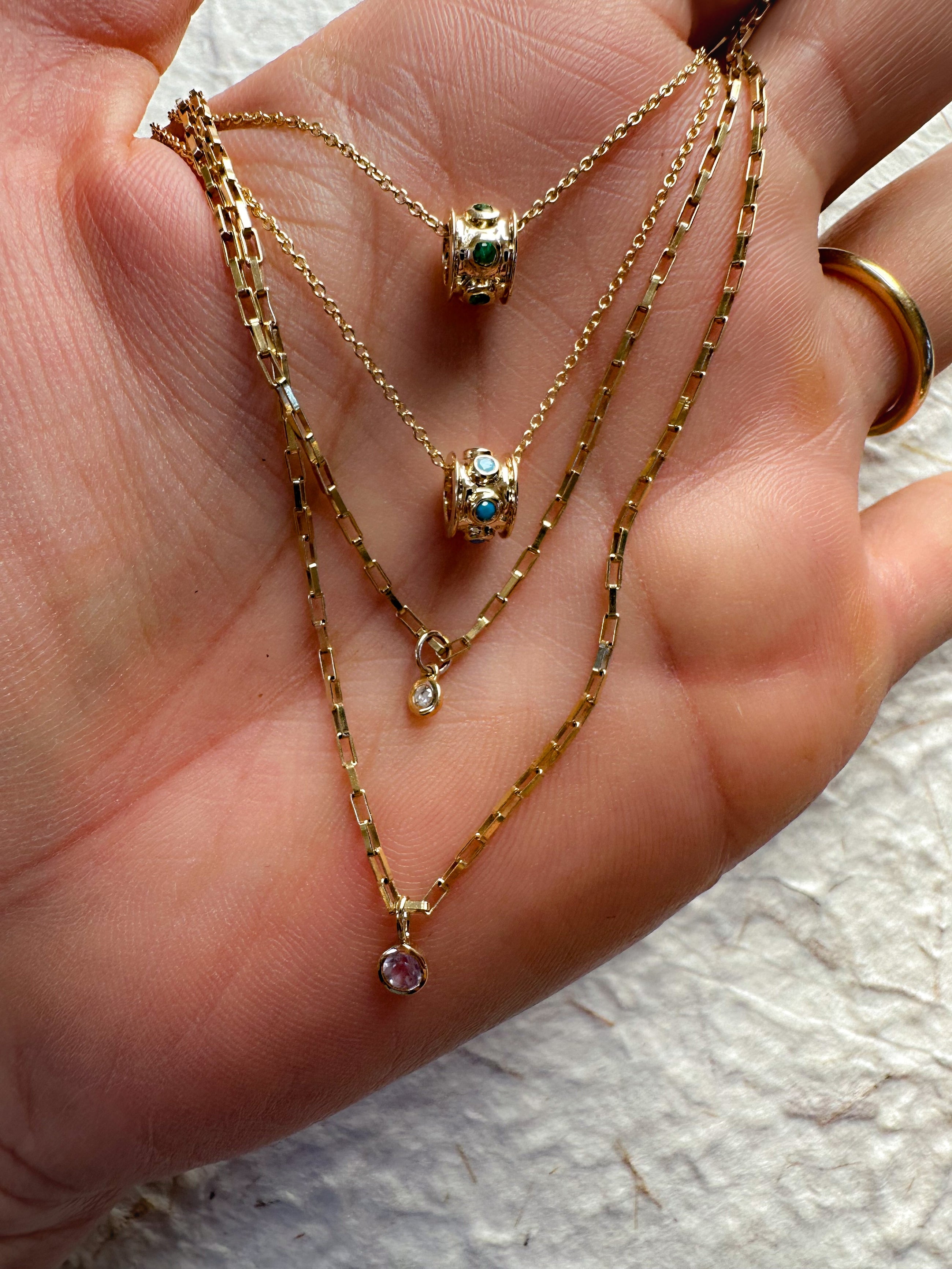 The Emerald Charm Necklace