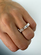 The Iconic Horizontal Emerald Eternity Band